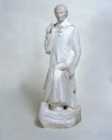 Statue : Saint Briac abordant sur une barque (?)