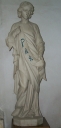 Ensemble de 2 statues en pendant : Jeune homme tenant un phylactère