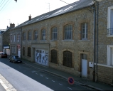 Usine de chaussures J. Tinguy, puis Casalonga et Blouin, puis Casalonga Chanteclair et Hubert, puis Hubert et Cie, actuellement immeuble à logements, 44, 46 rue Duguesclin (Fougères)