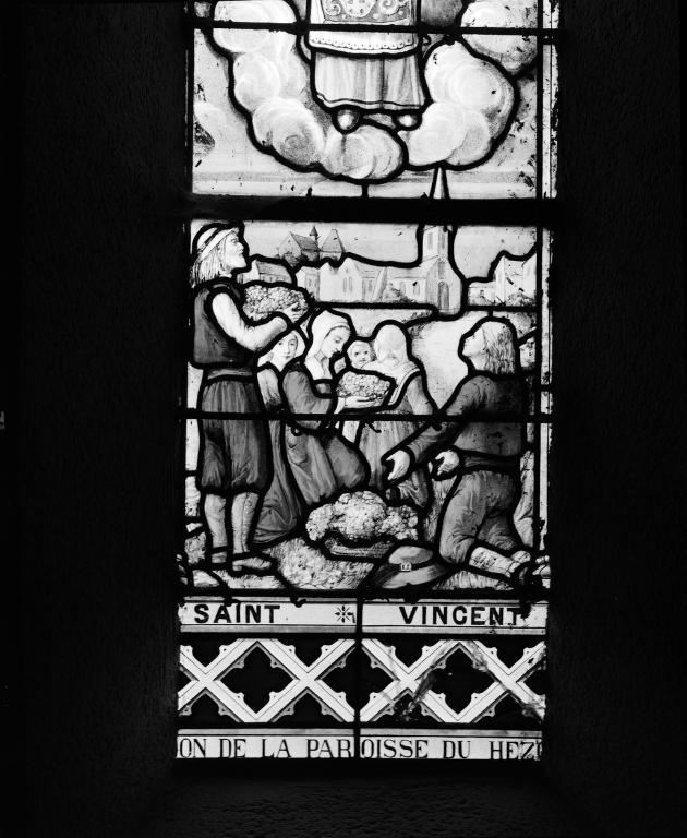 Verrière (8, verrière à personnage, verrière hagiographique) : vie de saint Vincent de Saragosse, saint Paterne de Vannes, saint Symphorien, saint Gildas, saint Goustan (baies 0,2,3,4,5,6,7,9), église paroissiale Saint-Vincent (Le Hézo)